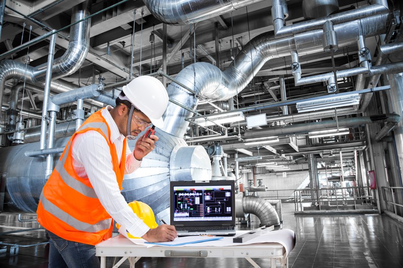Electrical engineer working at control room of a modern thermal power plant